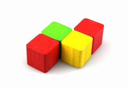 simsearch:400-06097126,k - Wooden building blocks on white background. Close Up. Stock Photo - Budget Royalty-Free & Subscription, Code: 400-05317200