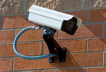 Security surveillance camera on the side of an industrial building Stock Photo - Budget Royalty-Free & Subscription, Code: 400-05318710