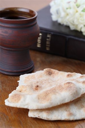 simsearch:400-05890930,k - Chalice with red wine, pita bread, Holy Bible and white hyacinth Stock Photo - Budget Royalty-Free & Subscription, Code: 400-05313956