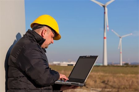 Technician Engineer in Wind Turbine Power Generator Station Stock Photo - Budget Royalty-Free & Subscription, Code: 400-05324238