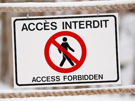 Bilingual access forbiden sign on rope in winter Stock Photo - Budget Royalty-Free & Subscription, Code: 400-05325723