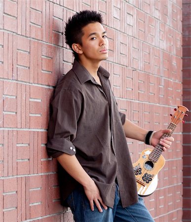 A photograph of a handsome young man with his Ukelele Stock Photo - Budget Royalty-Free & Subscription, Code: 400-05327192