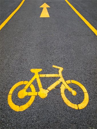 yellow arrows and bicycle sign path on the road Stock Photo - Budget Royalty-Free & Subscription, Code: 400-05327748