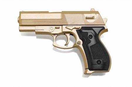Gold color plastic toy gun on white background Photographie de stock - Aubaine LD & Abonnement, Code: 400-05329007