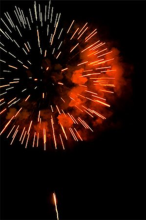 simsearch:400-06745167,k - A burst of orange-red fireworks against a night sky. Stock Photo - Budget Royalty-Free & Subscription, Code: 400-05329695