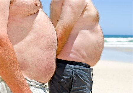 simsearch:400-06915547,k - Close up of two obese fat men of the beach Foto de stock - Super Valor sin royalties y Suscripción, Código: 400-05329925