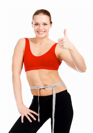 simsearch:400-04180657,k - Slim sporty woman showing thumb up sign after loosing weight. Stock Photo - Budget Royalty-Free & Subscription, Code: 400-05322515