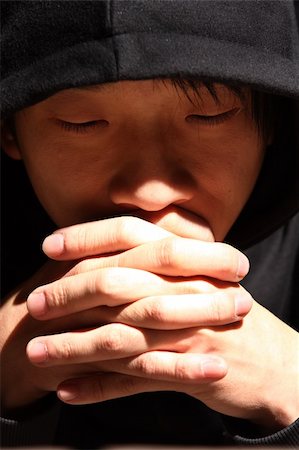 Closeup portrait of a young man praying to god Stock Photo - Budget Royalty-Free & Subscription, Code: 400-05323817