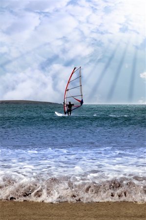 simsearch:400-03992760,k - person windsurfing in the maharees in county kerry ireland during a storm in rays of sunshine Stock Photo - Budget Royalty-Free & Subscription, Code: 400-05334524