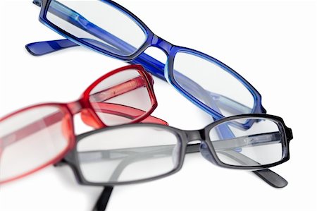 simsearch:400-07774329,k - Three pairs of spectacles with blue red and black frames on a white background Stock Photo - Budget Royalty-Free & Subscription, Code: 400-05335150