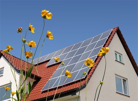 solar panel home - Solar cells on a roof with flowers in the foreground Stock Photo - Budget Royalty-Free & Subscription, Code: 400-05336353