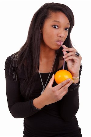 young black woman drinking orange juice Stock Photo - Budget Royalty-Free & Subscription, Code: 400-05337107