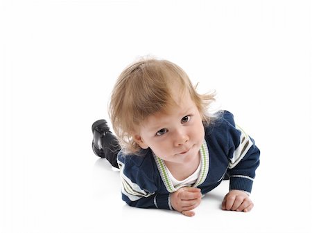 simsearch:400-04594888,k - Cute little child smiling on the floor . isolated on white background Stock Photo - Budget Royalty-Free & Subscription, Code: 400-05337165