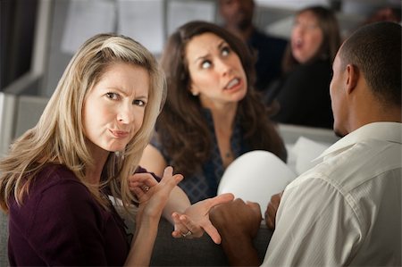 Annoyed woman with coworkers in office cubicle Stock Photo - Budget Royalty-Free & Subscription, Code: 400-05337434