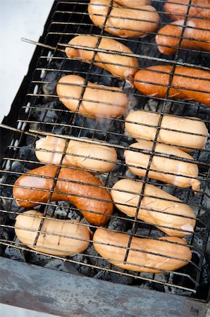 simsearch:400-04587885,k - grilled sausages on grill, with smoke above it Stock Photo - Budget Royalty-Free & Subscription, Code: 400-05337473