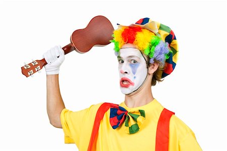 Colorful clown with ukulele isolated on white background Stock Photo - Budget Royalty-Free & Subscription, Code: 400-05337828
