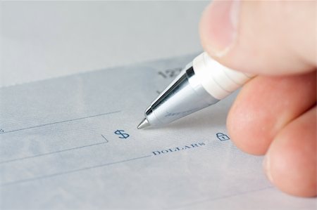 Close up shot of a check or check with a pen Stock Photo - Budget Royalty-Free & Subscription, Code: 400-05338501