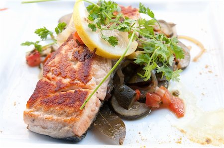 grilled salmon and lemon - french cuisine dish with tomato and salmon Stock Photo - Budget Royalty-Free & Subscription, Code: 400-05330100