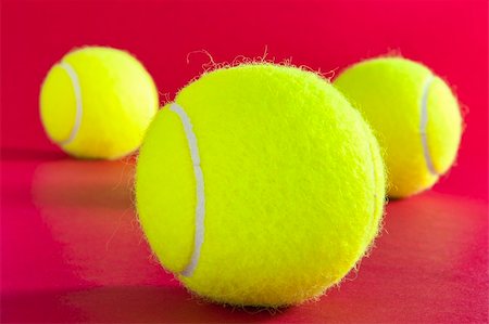 simsearch:400-04833689,k - Three tennis balls on red Stock Photo - Budget Royalty-Free & Subscription, Code: 400-05332276