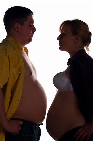 simsearch:400-04866555,k - man and pregnant woman is standing face to face and showing their bellies and kissing, side view Foto de stock - Super Valor sin royalties y Suscripción, Código: 400-05333830