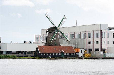 simsearch:400-05319608,k - dutch windmill surrounded by a large factory Stock Photo - Budget Royalty-Free & Subscription, Code: 400-05345346