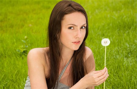 simsearch:400-04399510,k - Girl with dandelion on green field Stock Photo - Budget Royalty-Free & Subscription, Code: 400-05340195