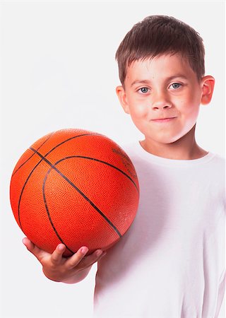 simsearch:400-04833689,k - boy in a white vest holds a ball for game in basketball. Stock Photo - Budget Royalty-Free & Subscription, Code: 400-05342611