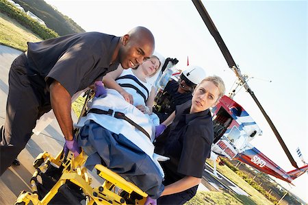 simsearch:400-05343071,k - Paramedics unloading patient from Medevac Stock Photo - Budget Royalty-Free & Subscription, Code: 400-05343074