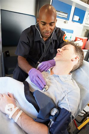 simsearch:400-05343071,k - Paramedic attending to patient in ambulance Stock Photo - Budget Royalty-Free & Subscription, Code: 400-05343070