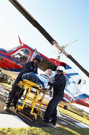 simsearch:400-05343071,k - Paramedics unloading patient from Medevac Stock Photo - Budget Royalty-Free & Subscription, Code: 400-05343073