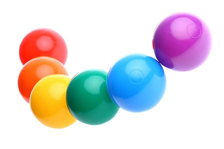 simsearch:400-07578126,k - Red, orange, yellow, green, blue and violet toy balls chained together on seamless white background Stock Photo - Budget Royalty-Free & Subscription, Code: 400-05343469