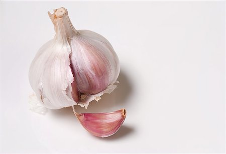 Fresh purple garlic isolated on white background Stock Photo - Budget Royalty-Free & Subscription, Code: 400-05343917