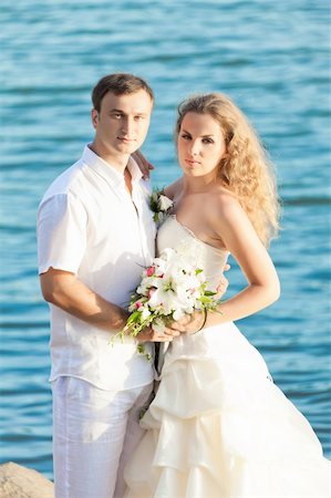 simsearch:400-05328142,k - Bride and groom on the beach. Tropical wedding Stock Photo - Budget Royalty-Free & Subscription, Code: 400-05355631