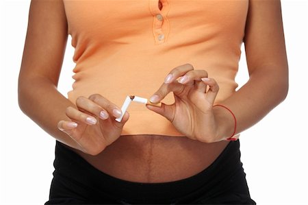 simsearch:400-04875116,k - Pregnant woman breaking a cigarette - stop smoking concept Stock Photo - Budget Royalty-Free & Subscription, Code: 400-05356503