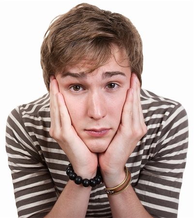 simsearch:400-05388090,k - Bored young man with hands on face over white background Stock Photo - Budget Royalty-Free & Subscription, Code: 400-05356874