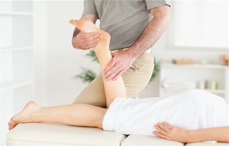 simsearch:400-05357105,k - A woman's leg is massaged by a masseur Stock Photo - Budget Royalty-Free & Subscription, Code: 400-05357452