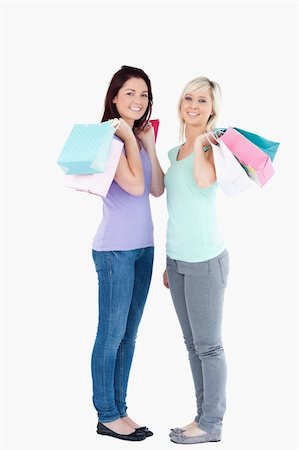 simsearch:400-04904785,k - Smiling women with shopping bags in a studio Stock Photo - Budget Royalty-Free & Subscription, Code: 400-05357767
