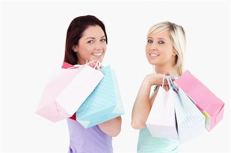 simsearch:400-04904785,k - Cheerful women with shopping bags in a studio Stock Photo - Budget Royalty-Free & Subscription, Code: 400-05357797
