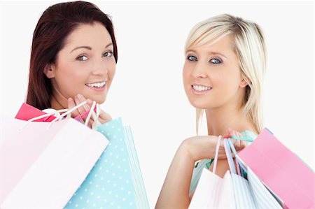 simsearch:400-04904785,k - Cheering women with shopping bags in a studio Stock Photo - Budget Royalty-Free & Subscription, Code: 400-05357798