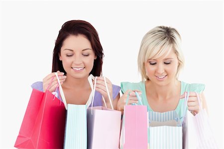simsearch:400-04904785,k - Happy young women with shopping bags in a studio Stock Photo - Budget Royalty-Free & Subscription, Code: 400-05357801