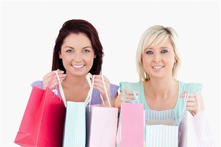 simsearch:400-04904785,k - Cheerful young women with shopping bags in a studio Stock Photo - Budget Royalty-Free & Subscription, Code: 400-05357802