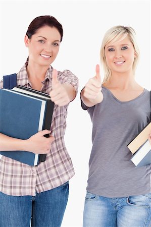 simsearch:400-05357982,k - Two gorgeous students with books and thumbs up Stock Photo - Budget Royalty-Free & Subscription, Code: 400-05357944