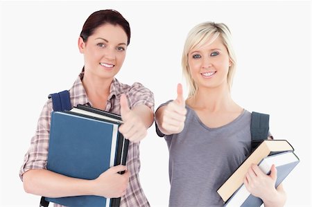 simsearch:400-05357982,k - Two female students with books and thumbs up Stock Photo - Budget Royalty-Free & Subscription, Code: 400-05357945
