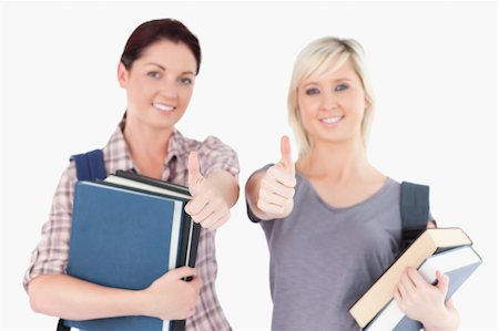 simsearch:400-05357982,k - Two gorgeous female students with books and thumbs up Stock Photo - Budget Royalty-Free & Subscription, Code: 400-05357946