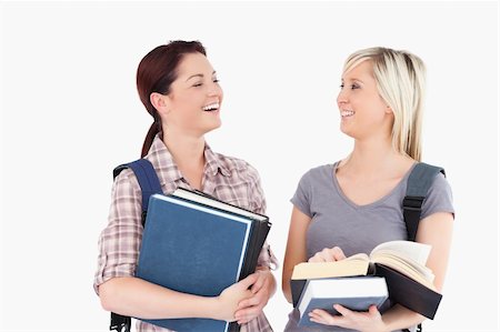 simsearch:400-05357982,k - Two laughing female students looking at each other Stock Photo - Budget Royalty-Free & Subscription, Code: 400-05357949