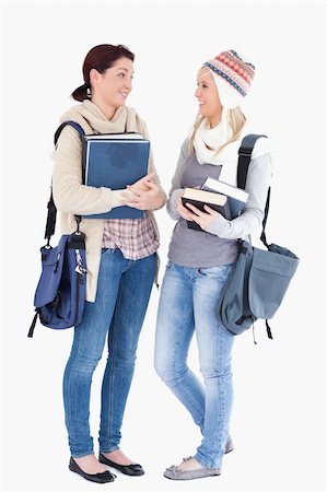 simsearch:400-05357982,k - Two cute female students with books talking Stock Photo - Budget Royalty-Free & Subscription, Code: 400-05357952