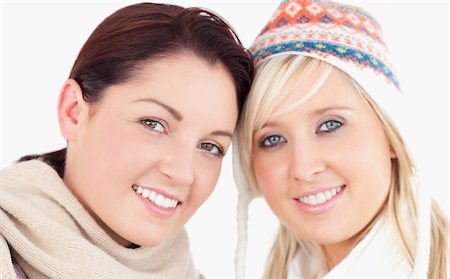 simsearch:400-05357982,k - Two pretty women with heads together looking to camera Stock Photo - Budget Royalty-Free & Subscription, Code: 400-05357961