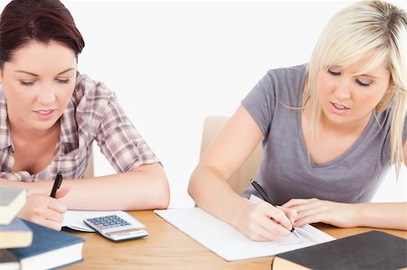 simsearch:400-05357982,k - Two pretty students doing homework Stock Photo - Budget Royalty-Free & Subscription, Code: 400-05357975