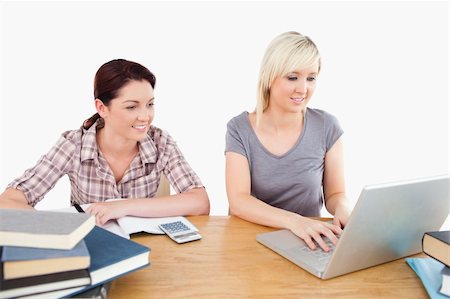 simsearch:400-05357982,k - Two lovely women learning at a table Stock Photo - Budget Royalty-Free & Subscription, Code: 400-05358774