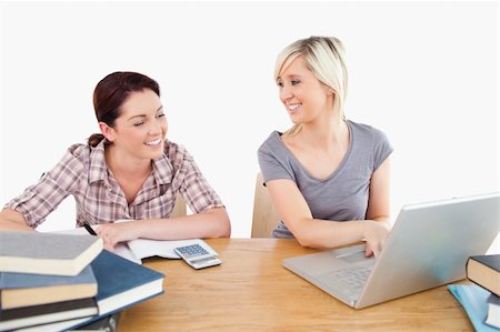 simsearch:400-05357982,k - Two lovely women learning with a laptop and books at a table Stock Photo - Budget Royalty-Free & Subscription, Code: 400-05358776
